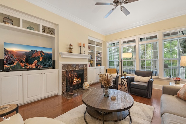 living room featuring crown molding, dark hardwood / wood-style floors, and plenty of natural light