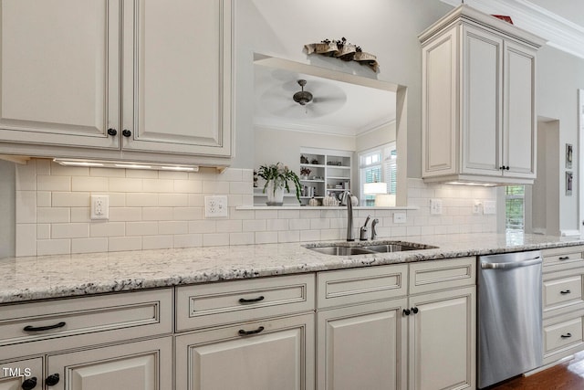 kitchen featuring ornamental molding, sink, light stone countertops, stainless steel dishwasher, and tasteful backsplash