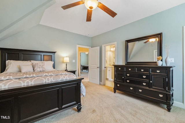 carpeted bedroom featuring ensuite bath, vaulted ceiling, and ceiling fan