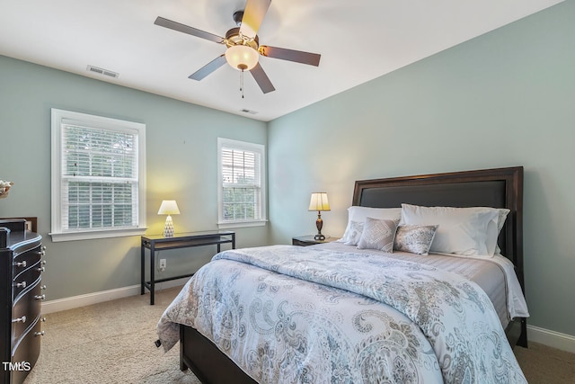 bedroom featuring ceiling fan and light colored carpet