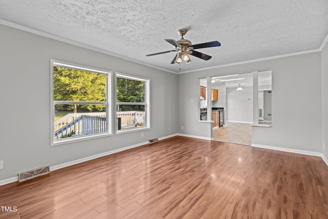 unfurnished living room with ceiling fan, hardwood / wood-style flooring, and a textured ceiling