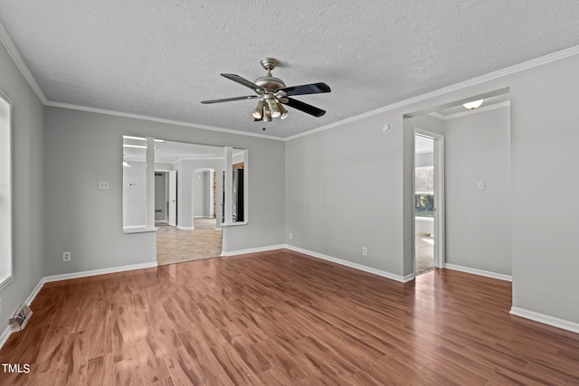 unfurnished room with ceiling fan, hardwood / wood-style flooring, crown molding, and a textured ceiling