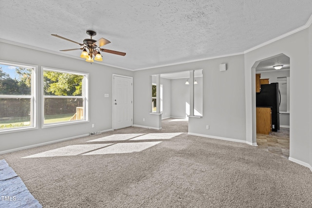 unfurnished living room featuring a textured ceiling, light colored carpet, ceiling fan, and crown molding