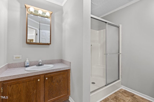 bathroom featuring ornamental molding and vanity