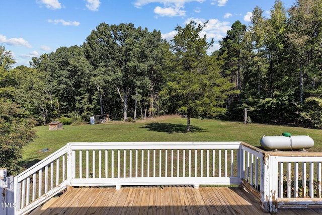 wooden terrace featuring a yard