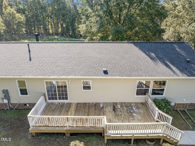 rear view of property featuring a deck