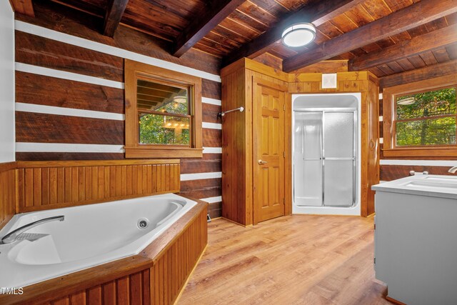 bathroom featuring wood walls, shower with separate bathtub, lofted ceiling with beams, wooden ceiling, and vanity