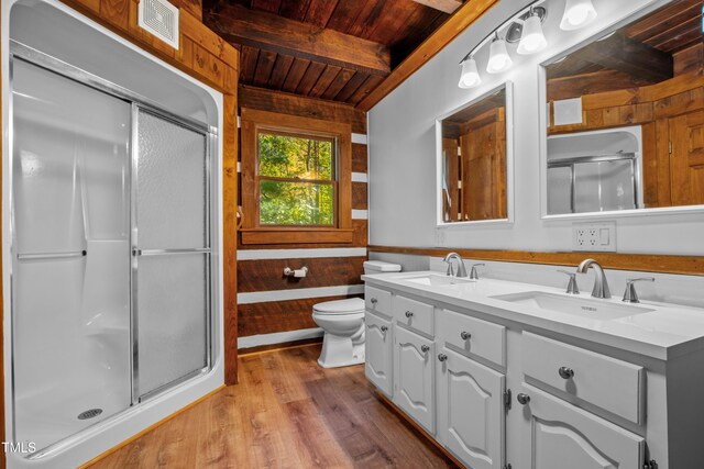 bathroom with vanity, toilet, wooden ceiling, and a shower with shower door