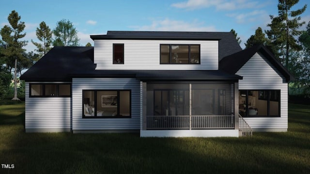 back of house featuring a lawn and a sunroom