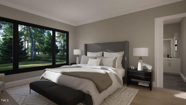 bedroom featuring ornamental molding and light hardwood / wood-style flooring