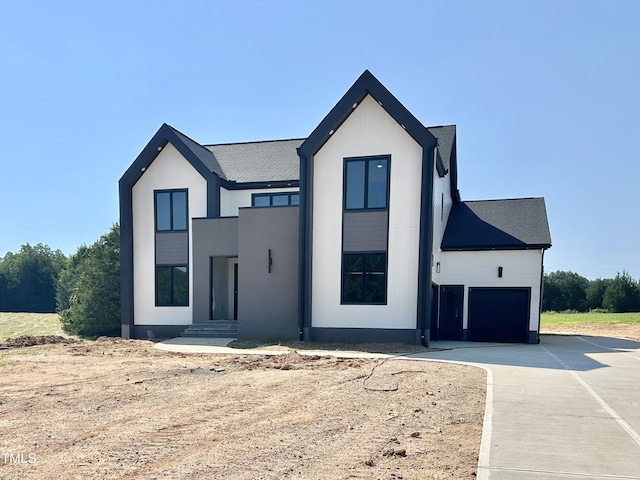 280 Forest Bridge Rd, Youngsville, NC 27596 - view of front of property with driveway, roof with shingles, and an attached garage