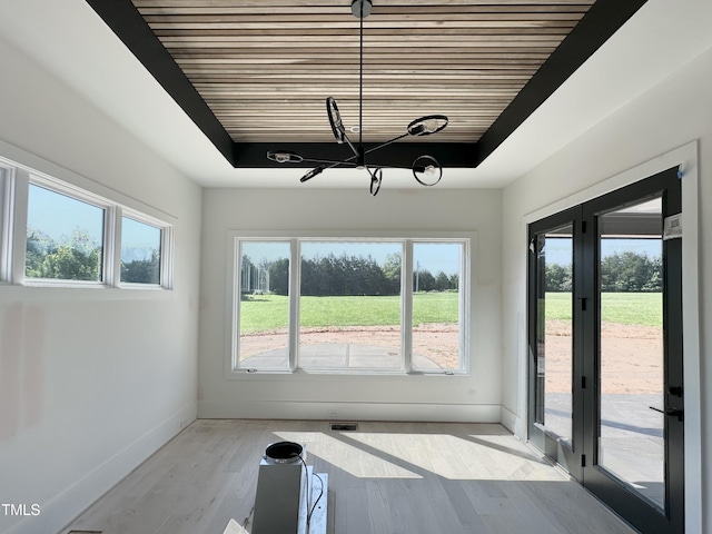 280 Forest Bridge Rd, Youngsville, NC 27596 - interior space with a chandelier, wooden ceiling, wood finished floors, and a tray ceiling