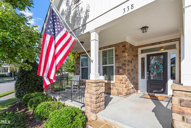 entrance to property with a porch