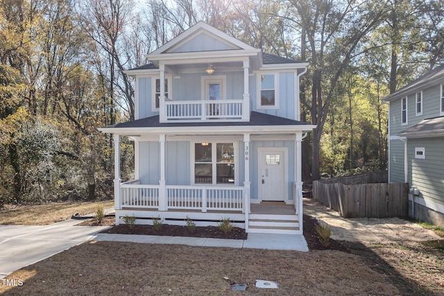 view of front of house featuring covered porch and a balcony