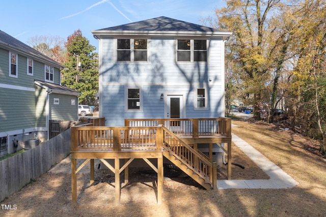 back of property with a wooden deck