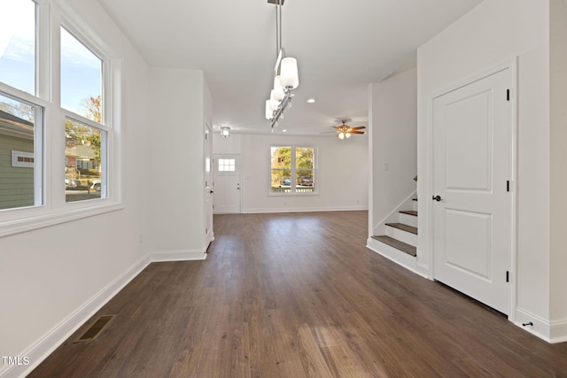 interior space featuring dark hardwood / wood-style flooring and ceiling fan