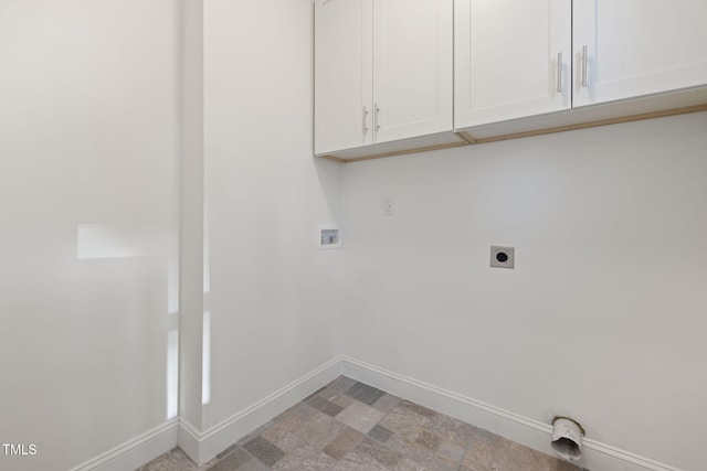 laundry room featuring hookup for an electric dryer, washer hookup, and cabinets