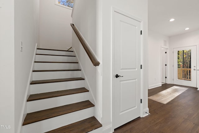 staircase featuring hardwood / wood-style flooring