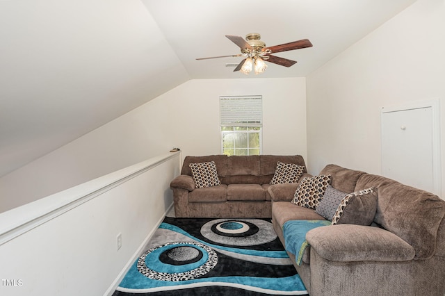 living room with ceiling fan and vaulted ceiling