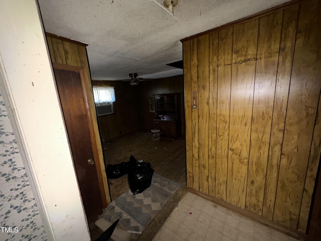 hallway with wood walls