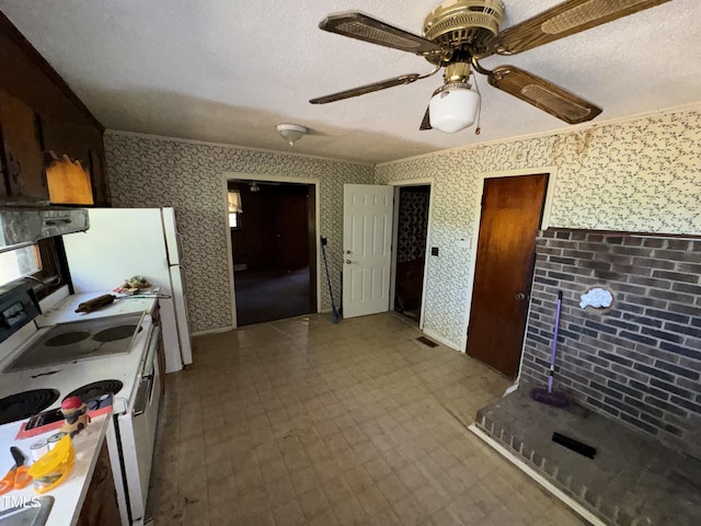 kitchen featuring white electric range oven, crown molding, ceiling fan, and a textured ceiling