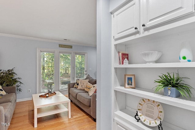 interior space featuring light hardwood / wood-style flooring and ornamental molding