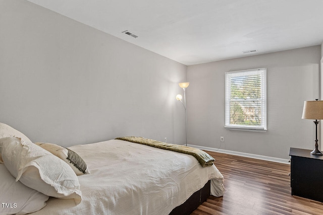 bedroom featuring hardwood / wood-style floors