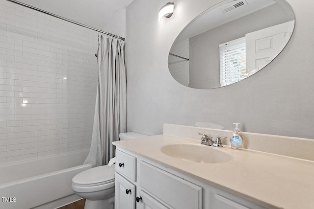 full bathroom featuring vanity, toilet, and shower / tub combo