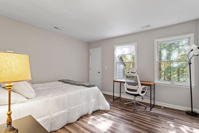 bedroom featuring wood-type flooring