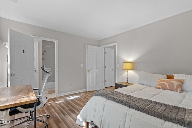 bedroom with hardwood / wood-style floors