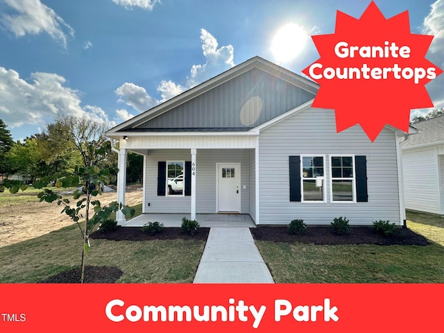 view of front of home with a front lawn and covered porch