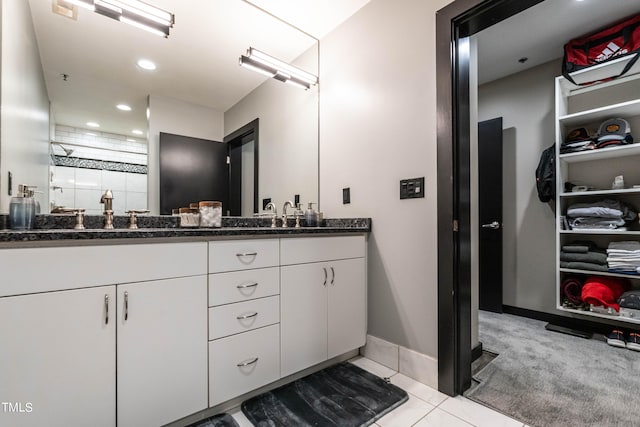 bathroom featuring tile patterned flooring and vanity