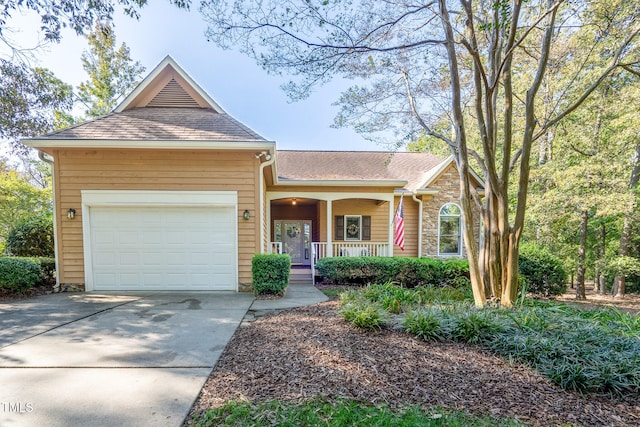 view of front facade with a porch and a garage