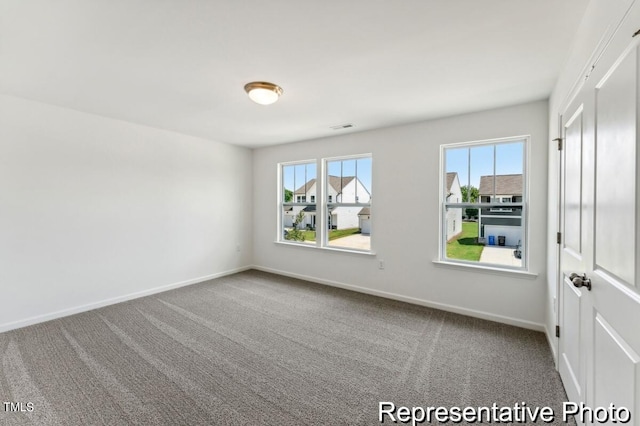 empty room featuring carpet flooring