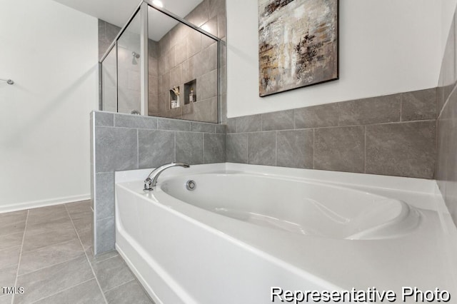 bathroom featuring separate shower and tub and tile patterned flooring