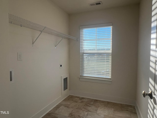 washroom with a healthy amount of sunlight and electric dryer hookup