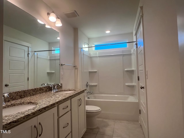 full bathroom featuring tile patterned floors, tub / shower combination, vanity, and toilet