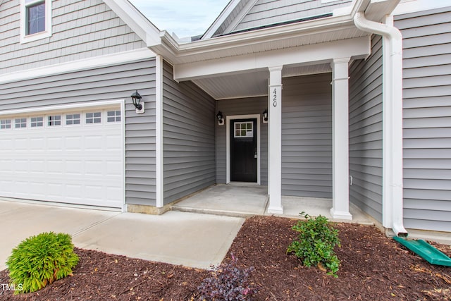 doorway to property featuring a garage