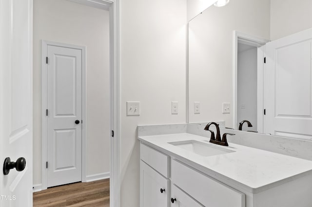 bathroom featuring vanity and wood-type flooring