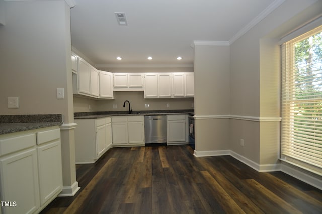 kitchen with dark hardwood / wood-style flooring, white cabinetry, ornamental molding, and stainless steel dishwasher