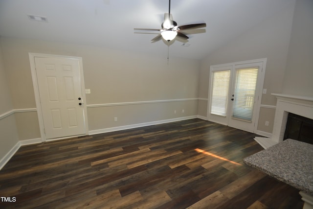 living room featuring vaulted ceiling, ceiling fan, and dark wood-type flooring