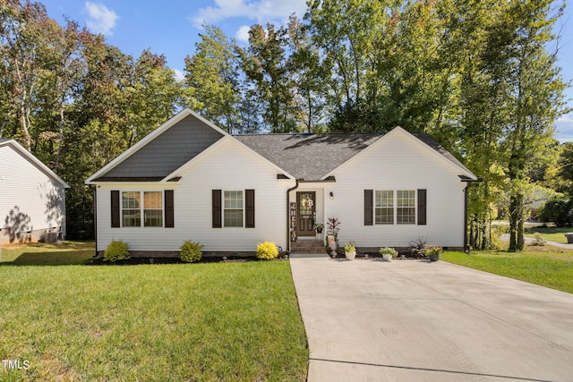 ranch-style house featuring a front lawn and central air condition unit