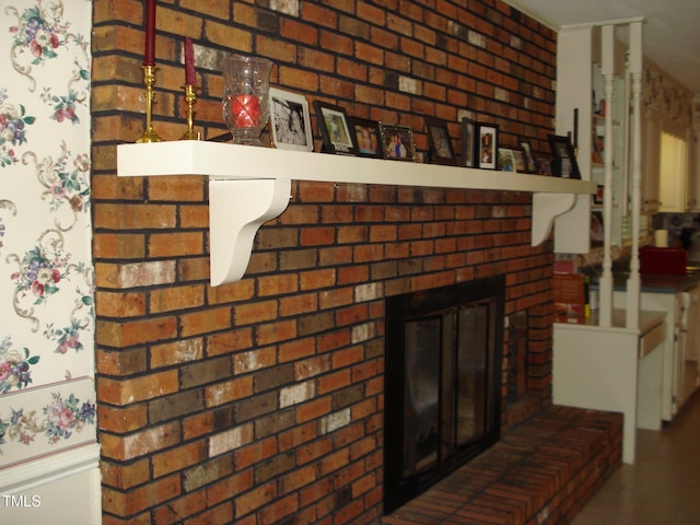 details featuring a brick fireplace