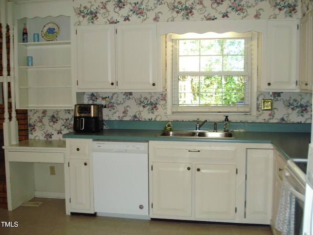 kitchen featuring white appliances, sink, and white cabinets