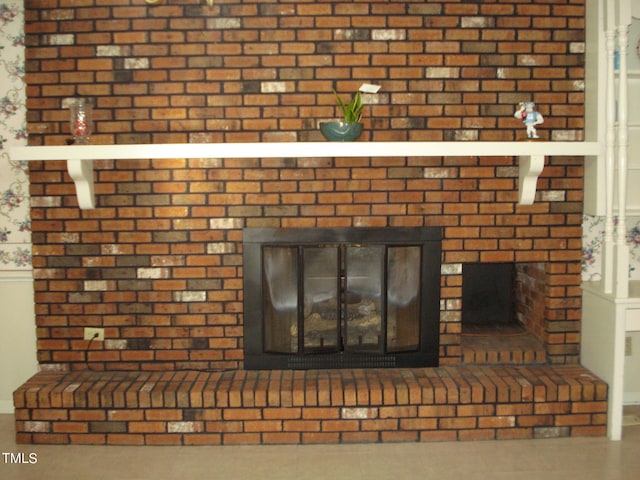 details featuring a brick fireplace