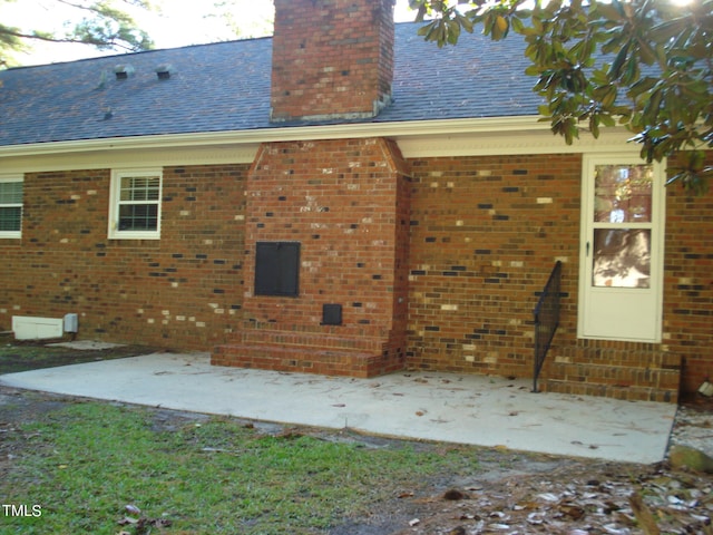 back of property featuring a patio