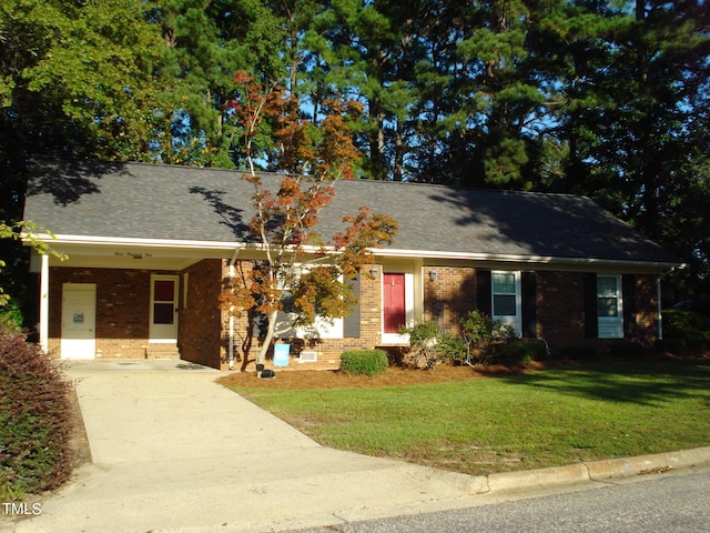 single story home featuring a front lawn