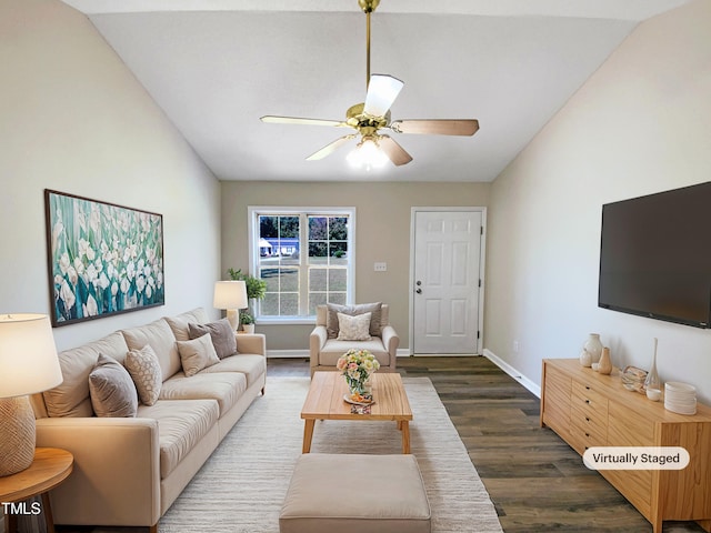 living room featuring lofted ceiling, ceiling fan, and dark hardwood / wood-style flooring