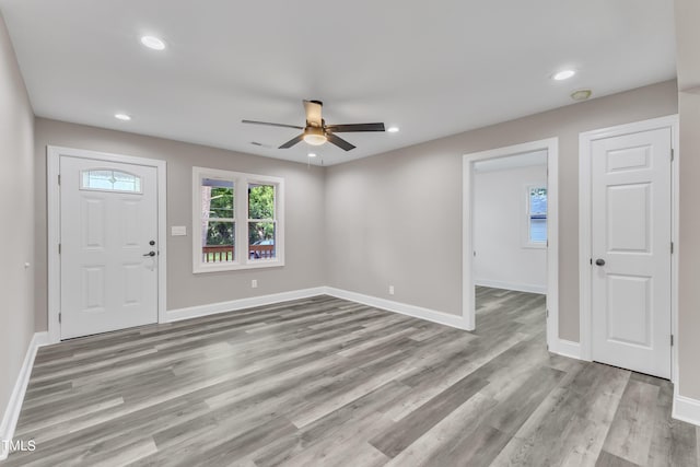 foyer entrance with recessed lighting, wood finished floors, a ceiling fan, and baseboards