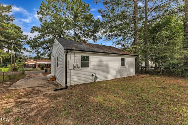 view of outbuilding with fence